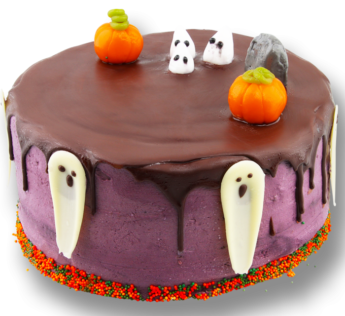 Halloween dripcake met chocoladeglazuur, paarse topping, spookjes, pompoenen en kleurrijke strooisels